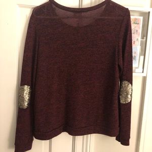 Rounded neck sweater with gold sequined elbow pads